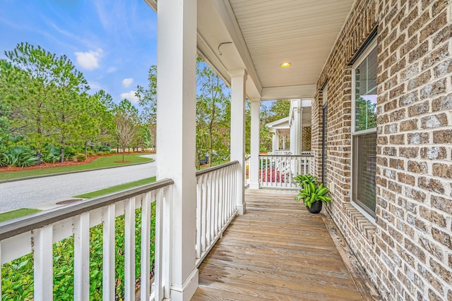 wooden terrace with a porch