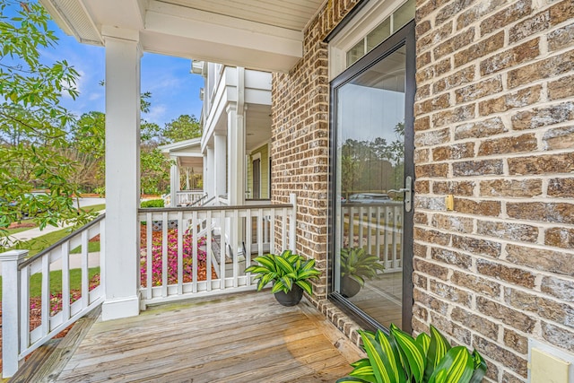 wooden terrace with a porch