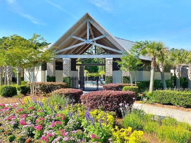 view of home's community featuring fence