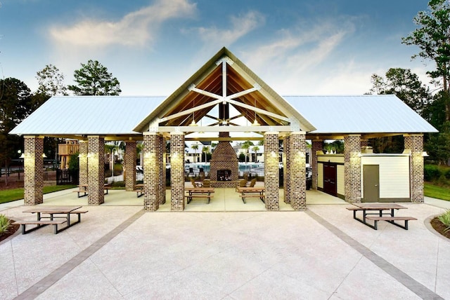 surrounding community with a gazebo and a patio area