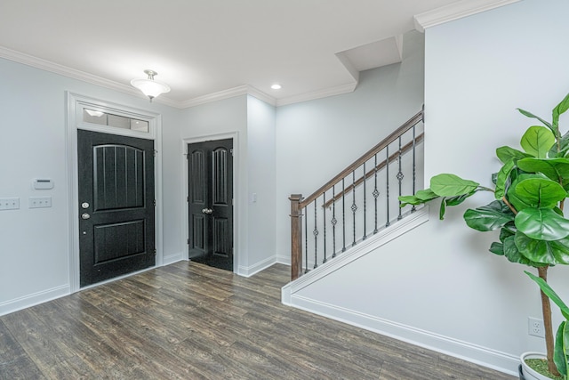 foyer featuring crown molding, stairway, wood finished floors, and baseboards