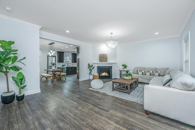 living room with a fireplace with flush hearth, wood finished floors, baseboards, and ornamental molding