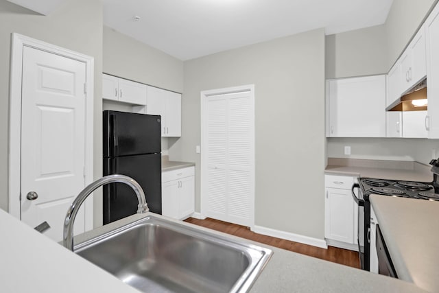 kitchen featuring white cabinetry, sink, dark hardwood / wood-style flooring, and black appliances