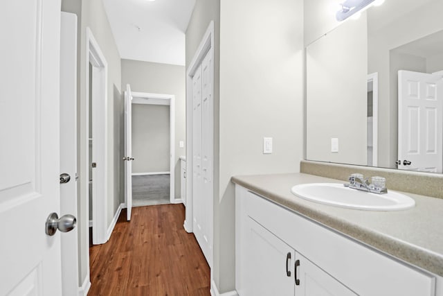 bathroom with vanity and hardwood / wood-style flooring