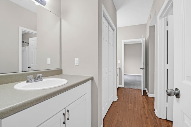 bathroom featuring vanity and wood-type flooring