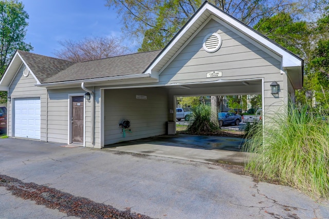 garage featuring a carport