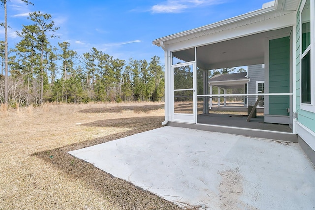 view of patio / terrace with a sunroom