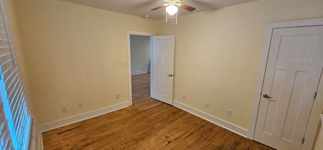 unfurnished bedroom with hardwood / wood-style floors and ceiling fan