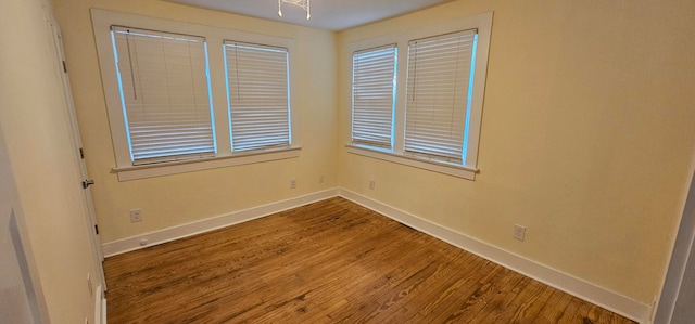 spare room featuring hardwood / wood-style flooring