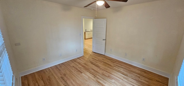 unfurnished room with light wood-type flooring and ceiling fan