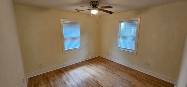 unfurnished room with light wood-type flooring and ceiling fan