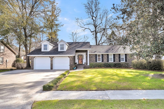 view of front of house with a garage and a front lawn