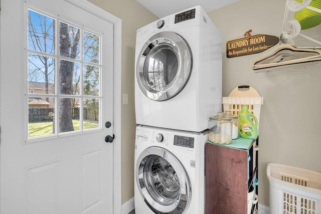 laundry area featuring stacked washer and dryer