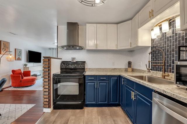 kitchen featuring stainless steel dishwasher, wall chimney exhaust hood, black range with electric cooktop, blue cabinetry, and white cabinets