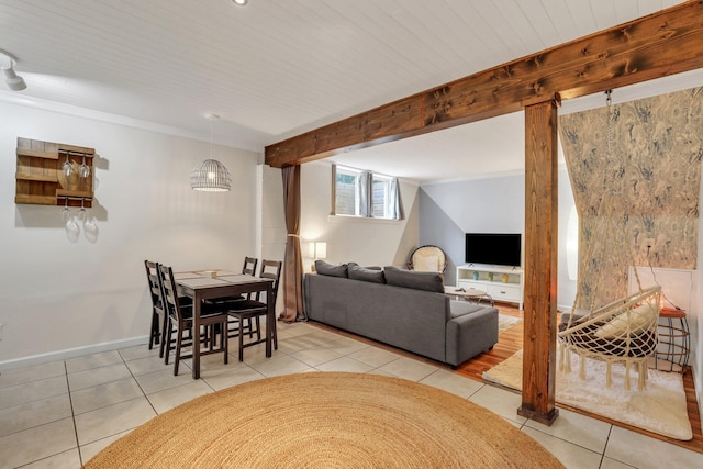 tiled living room with beamed ceiling