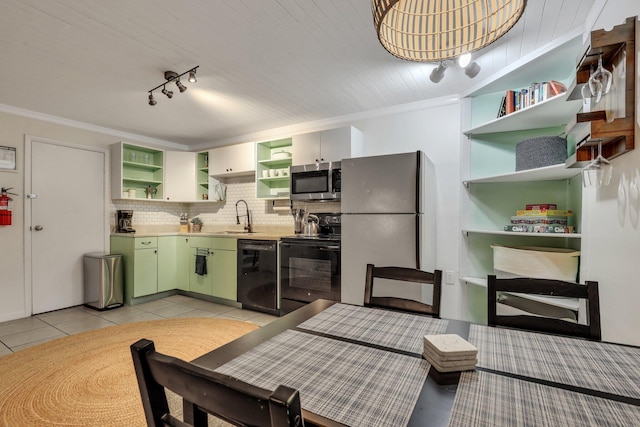 kitchen with black appliances, crown molding, sink, green cabinetry, and light tile patterned floors