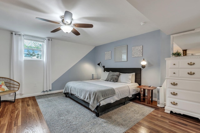 bedroom featuring ceiling fan and dark wood-type flooring