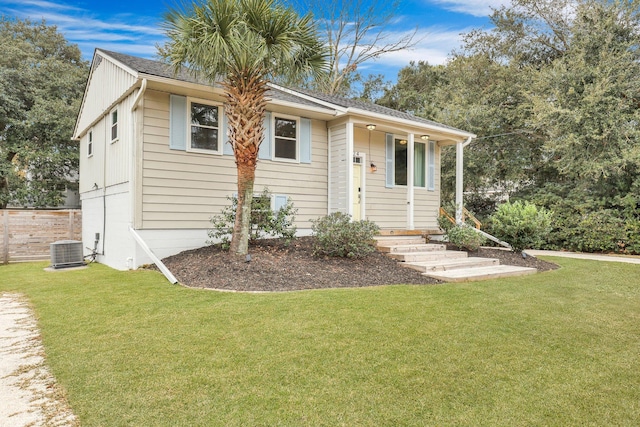 view of front of property with cooling unit and a front lawn