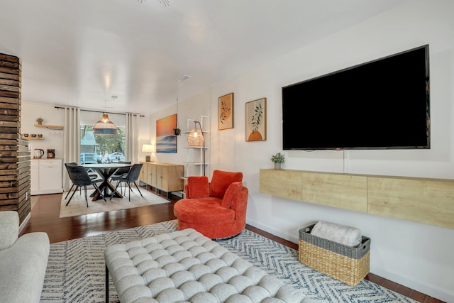 living room featuring dark hardwood / wood-style floors