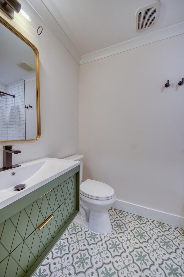 bathroom with baseboards, visible vents, tile patterned flooring, crown molding, and toilet