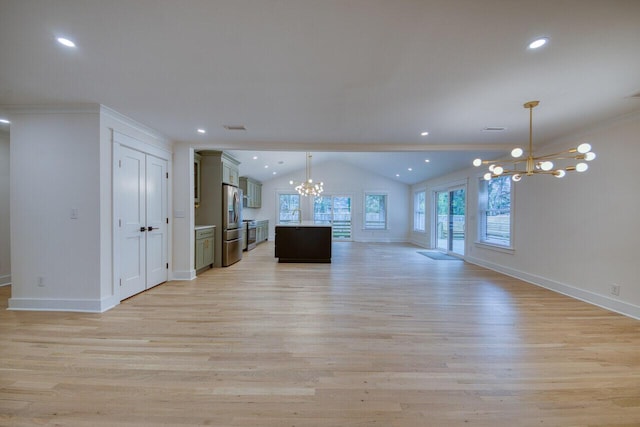 unfurnished living room with recessed lighting, lofted ceiling, a notable chandelier, and light wood finished floors