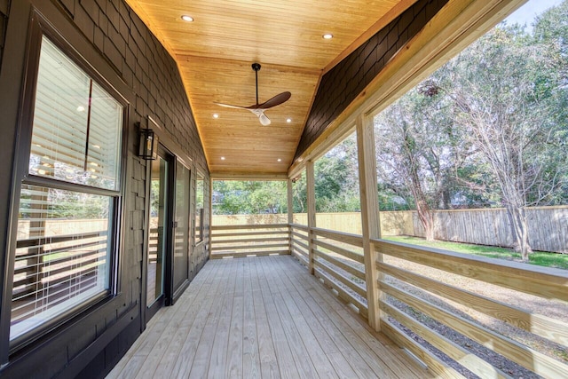 deck featuring a ceiling fan and fence