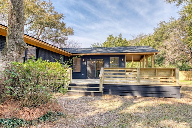 view of front facade featuring a wooden deck