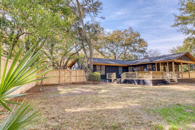 back of house with fence