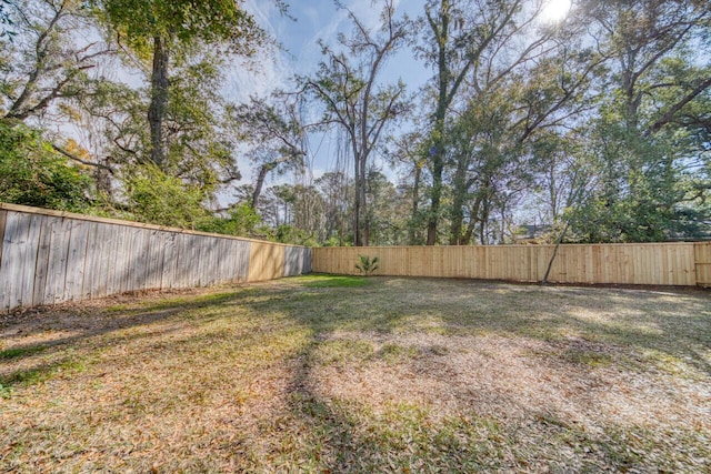 view of yard with a fenced backyard