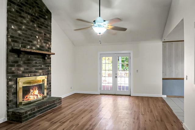 unfurnished living room with french doors, hardwood / wood-style flooring, ceiling fan, and lofted ceiling