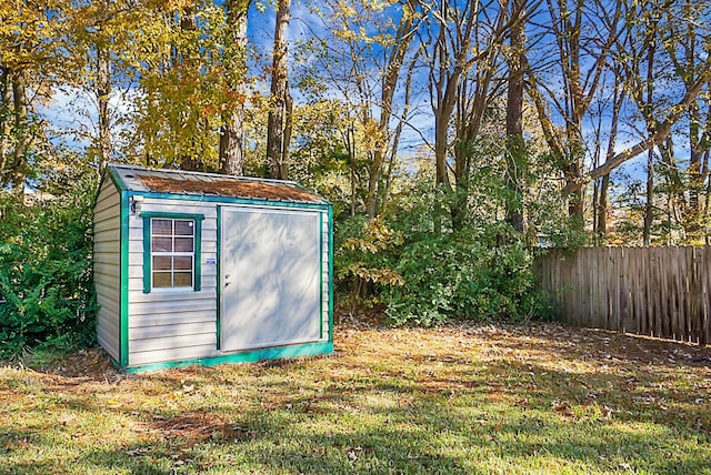 view of outbuilding featuring a yard