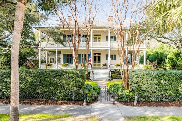 view of front of home featuring a balcony and covered porch