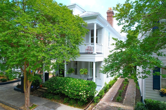 view of front of property with a balcony