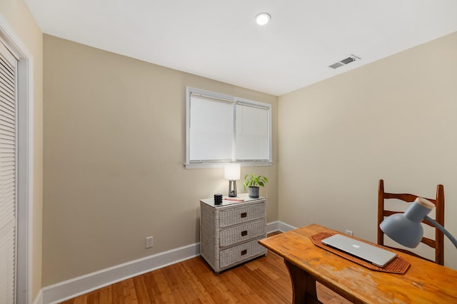 office with light wood finished floors, baseboards, visible vents, and recessed lighting