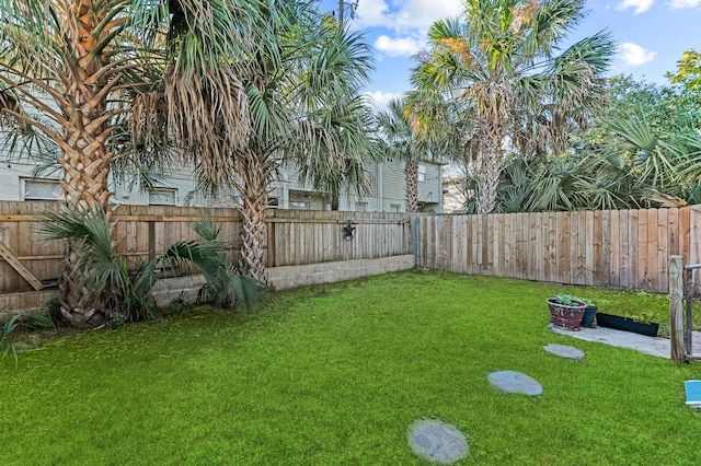 view of yard featuring a fenced backyard