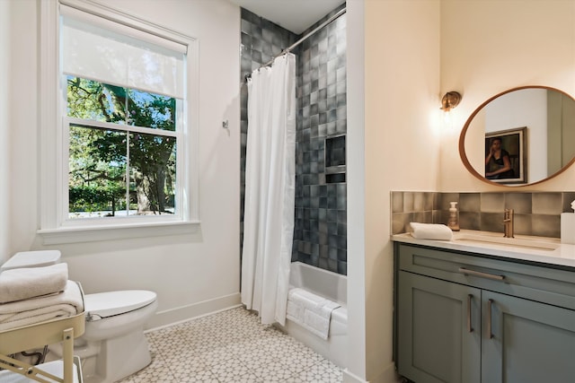 full bathroom with vanity, toilet, and shower / tub combo with curtain