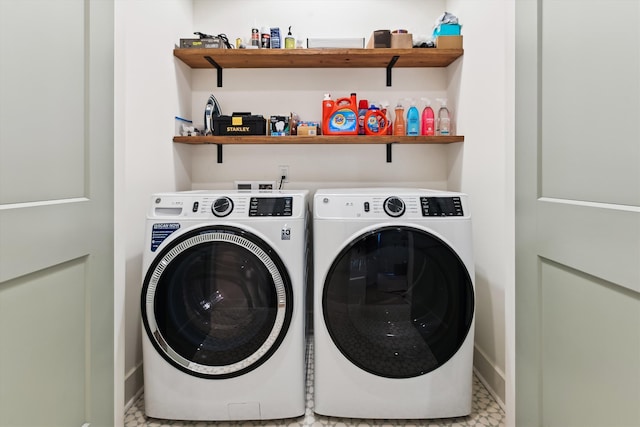 laundry room with washing machine and clothes dryer