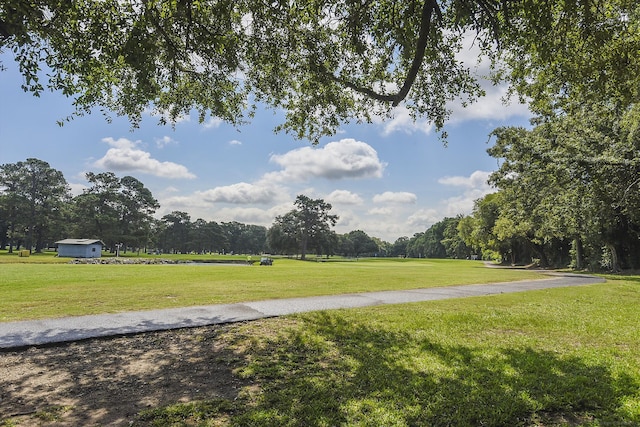 view of home's community with a lawn