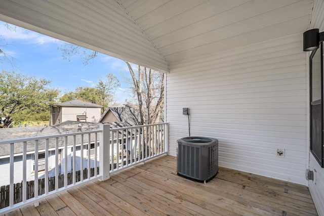 wooden terrace featuring central AC unit