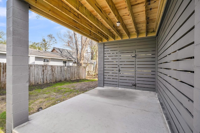 garage with fence