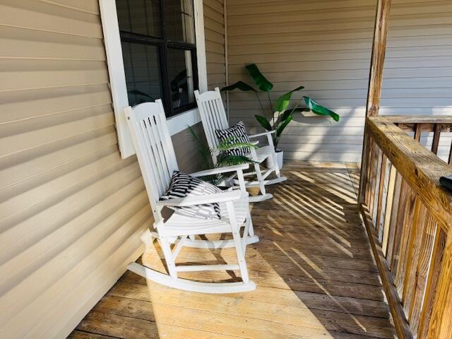 wooden deck featuring a porch