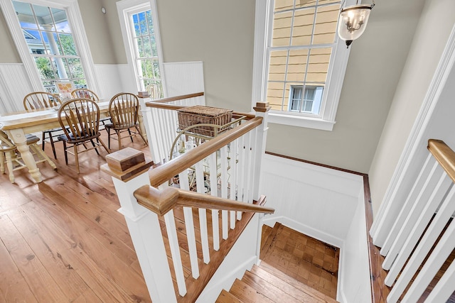 68 Vanderhorst St Unit B, Charleston, SC 29403 - stairway with wainscoting and wood-type flooring