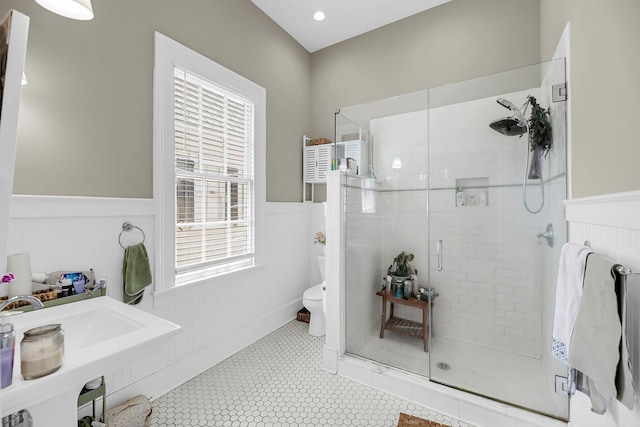 68 Vanderhorst St Unit B, Charleston, SC 29403 - bathroom featuring a shower stall and wainscoting