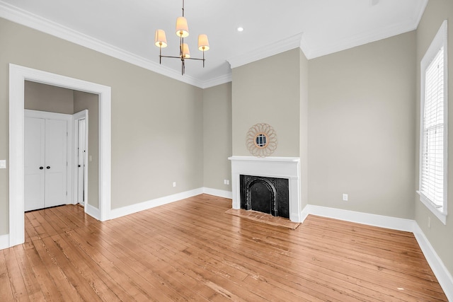 68 Vanderhorst St Unit B, Charleston, SC 29403 - unfurnished living room with ornamental molding, a chandelier, light wood-style floors, a fireplace, and recessed lighting
