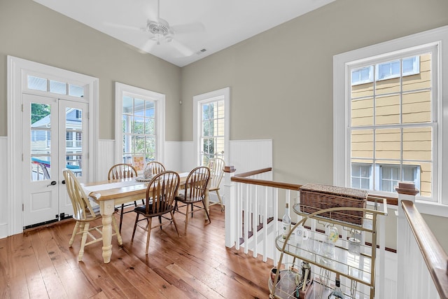 68 Vanderhorst St Unit B, Charleston, SC 29403 - dining room with a wainscoted wall, wood-type flooring, and ceiling fan