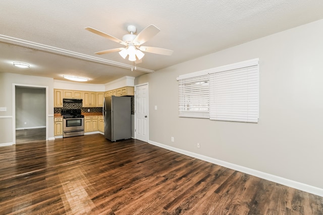 kitchen with ceiling fan, backsplash, appliances with stainless steel finishes, and dark hardwood / wood-style floors