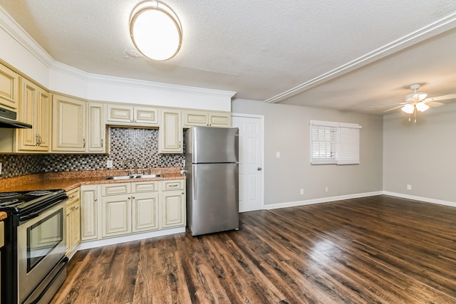 kitchen with dark hardwood / wood-style floors, sink, appliances with stainless steel finishes, crown molding, and cream cabinets