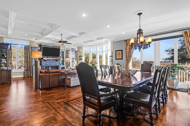 dining room featuring coffered ceiling, ceiling fan with notable chandelier, dark hardwood / wood-style floors, and beamed ceiling