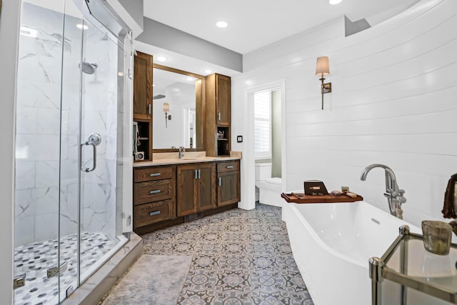 full bathroom featuring vanity, toilet, and plus walk in shower