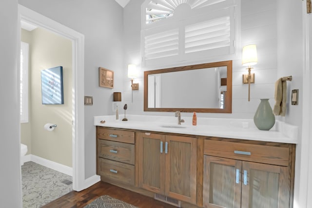 bathroom featuring vanity and hardwood / wood-style floors